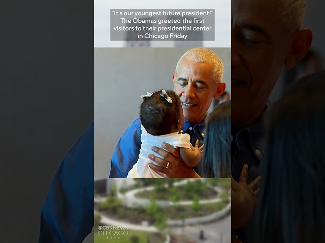 President Obama charmed by baby during at public opening of presidential center in Chicago