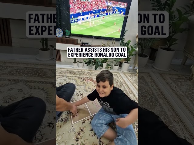 A dad making sure his son doesn't miss any part of the game